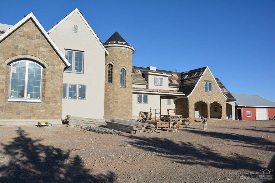 A French style 7815 SF home ready for your finishing touches. Also a 3000 SF utility building, a horse shelter & hay shed. 139.48 acres located on Hwy 97 & Jericho Lane. 117 acres with Round Up Ready alfalfa, 2 acres of Apple Trees & 9 acres grass hay. 4 pivots & solid set sprinklers. All Valley panels. Paved driveway and a very pristine property. Must see to appreciate. Not listed is the 565 SF changing room.