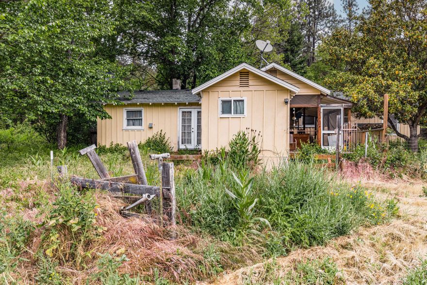 Heart of Applegate Valley, only 15 minutes to town. 1.5 acres, zone EFU. Single level home with large garage, barn, as well as a detached ADU with bathroom and kitchenette. House has new main line plumbing. A roof with lots of life left, as well as most of the windows are new double pane. Lot is fully fenced and flat, with lots of room for a large family garden or animals. Opportunity awaits for buyers to put finishing touches on the home. Priced to sell.