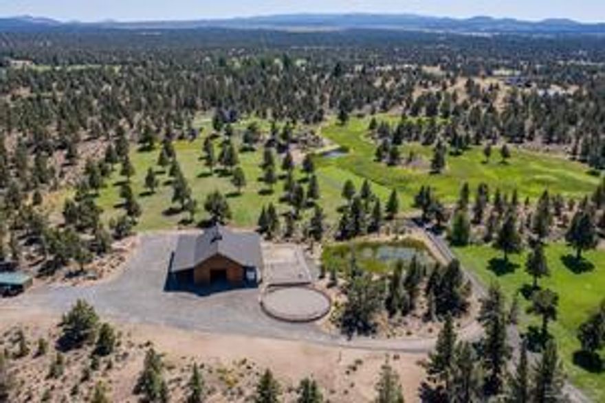 Welcome to a place where 17.49 pristine and unspoiled acres of natural beauty and exquisite craftsmanship meet in the most harmonious way. Once inside the gate, a world of unique beauty and splendor awaits at this private hilltop escape offering commanding views of the Cascade mountain range to the west and Pine Mountain to the east! Situated less than 10 minutes from downtown Bend, this spectacular retreat is secluded yet very accessible. The 3-bedroom, 2-bath, 1988 sq ft home was thoughtfully designed to maximize the topography and the setting. Quality workmanship and gorgeous materials create inviting living spaces with grand views that welcome the outside in. The barn consists of 4 stalls, 1 foaling stall, heated tack room, double office, heated finished storage with work bench, enclosed hay/equipment storage, RV parking, domestic water, paddocks, fenced pasture and a round pen. Fall in love with the serenity of the space and add your name to the legacy of the land.