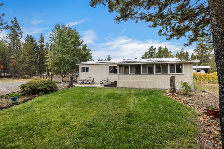 One-acre in the SOUGHT AFTER location of THREE RIVERS SOUTH! This tidy 2 bedroom 2 bath home features a bonus area built on the front of the house along with a 2 car garage attached by a covered breezeway. The property has a new well, updated septic system and new hot water heater.
The property comes with a 2005 fifth wheel trailer that can be used as guest quarters or out-of-town adventures. There are two greenhouses, two storage sheds and a chicken coupe with Aviary. The current coupe tenants (the hens) don't want the hassle of relocating, so they'd like to stay in their home in exchange for some fresh organic eggs! The garden area is ready to produce fresh garden vegetables. Enjoy some green lawn and a circular driveway for easy access.