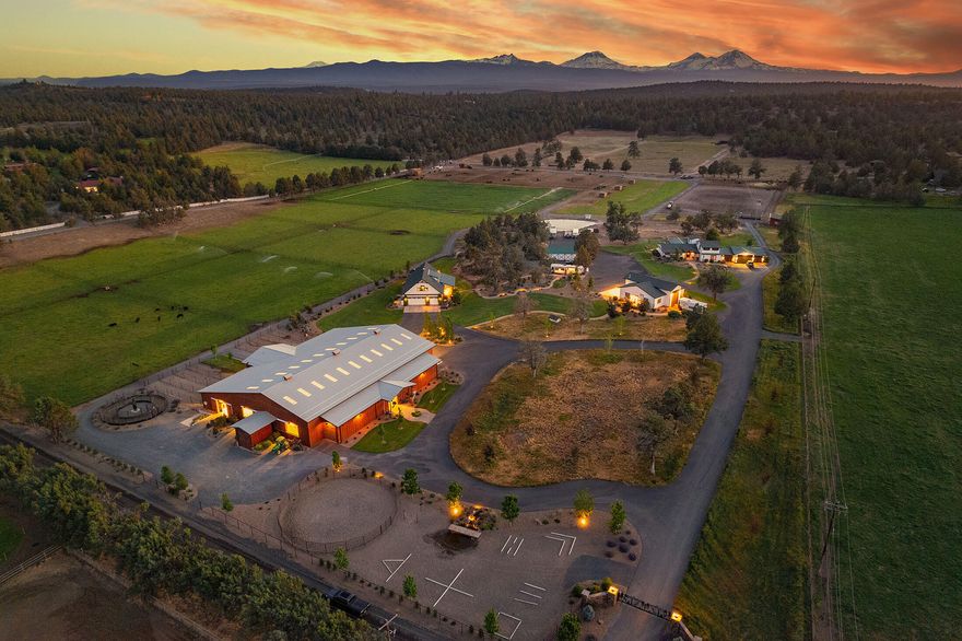 Horseman's Dream of Central Oregon is a 35.21± acre estate w/ 18.6± acres of water rights that backs up to Bureau of Land Management (BLM) land in one of Oregon's most desirable rural areas, Tumalo. Boasting a luxurious 3,000± square foot, 5-bedroom, 5-bathroom (3 are suites) home with luxury finishes, a covered outdoor patio, & a 4-car garage. Additionally, it has a recently built (2021) 1,862± square foot hobby building w/ multiple rooms that could serve offices, two bathrooms, and a fully covered and screened outdoor kitchen. Both structures have been recently built or remodeled with impeccable care. This is the horseman's dream. The recently built (2021) indoor arena w/ 8 stalls w/runs, washstall, tackroom, a feed room, multiple hay storage areas, automatic watering system for the arena, and heated/automatic waterers. Add a trail course, Priefert hot walker, outdoor roping arena, custom pipe fencing, automatic waterers, round pen, & even a small feedlot for cattle.