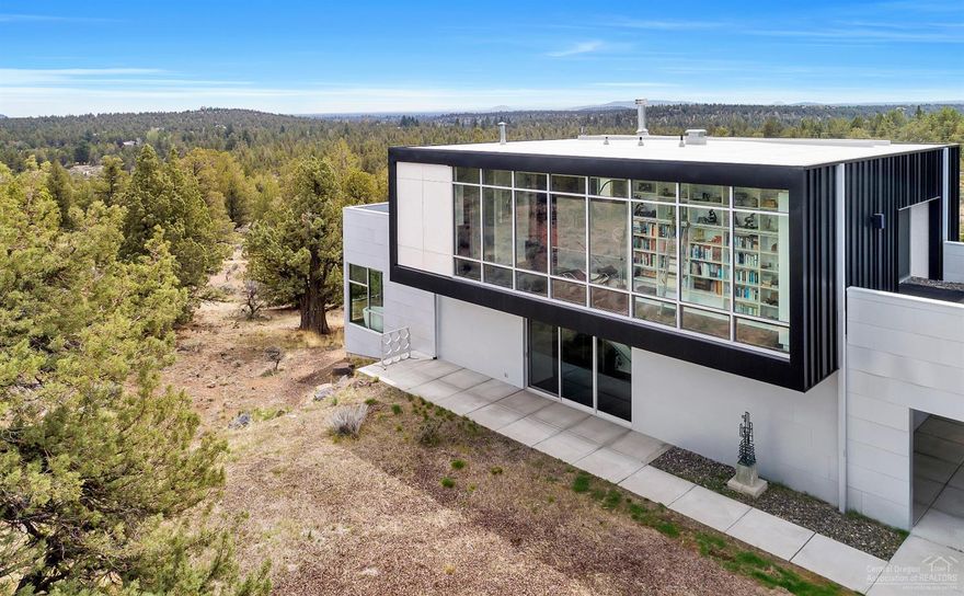 This stunning contemporary home designed by PIQUE Architecture was featured on HGTV Extreme Homes! Vast territorial views of Central Oregon from 3 separate decks on over 9 acres of land makes this extremely quiet location a peaceful oasis. A custom built home with Pedini kitchen cabinetry, Richlite countertops, high-end appliances, induction cook top and large custom built dining table for the cooking enthusiast! Amazing 11-foot Fleetwood sliding glass doors. This contemporary home is breathtaking and a must be seen to appreciate how special it is!