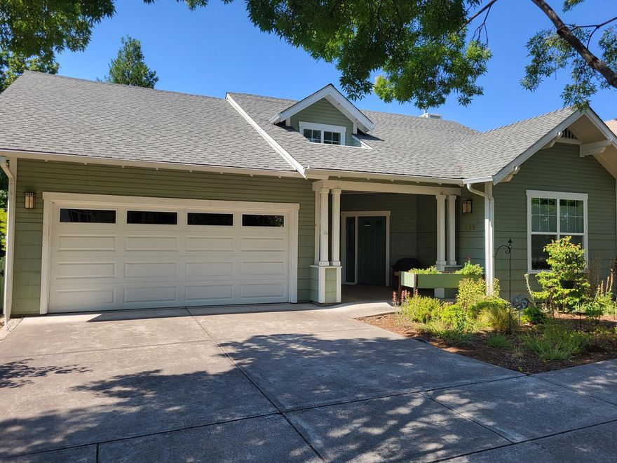Beautiful Craftsman single family home overlooking the park in Mountain Meadows 55+ Community! A lovely large front sitting porch welcomes you! Great 2-car garage with storage and access into home through laundry room.  Large open living room with fireplace and arched opening to the dining room and views to the deck and park beyond. Beautiful large deck and landscaped and fenced back yard area with access to basement. Walk-thru kitchen design, lots of room near kitchen for hutch or cabinet, and window for natural light.  Bonus room makes a great sitting room or office with large terrestrial window and French doors.  Primary bedroom suite with park views, walk in closet and easy access shower.  This home overlooks a small creek and the trees and vegetation near the park - a very quiet and private setting. Home shows pride of ownership - do not miss this opportunity.