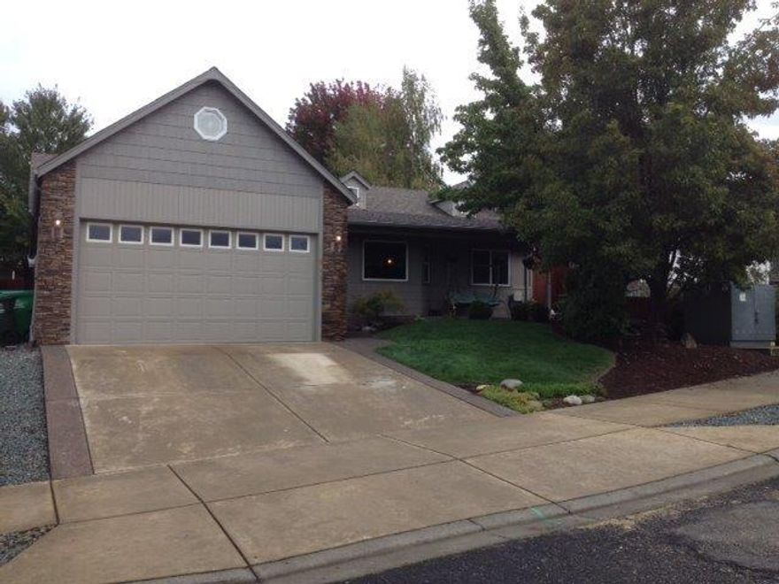 Single owner home with all the extra touches and amenities that make a house a home. Some of the amenities featured in this nice home include; solid oak doors, classic Italian style tile in dining area, a large kitchen with a pass thru to the eating bar, kitchen counters are granite, incredible number of solid wood cabinets with European style hinges. Open living room, entry with vaulted ceiling, custom decorative archways for plants & art displays. The master bedroom is spacious with a big mater bathroom with walk-in closet. Both main bathroom and master bath have tiled floors. The convenient laundry area leads to the oversized garage with 10' ceilings. The backyard patio, like the front porch has attractive aggregate concrete. The relaxing backyard offers lots of room for entertaining but not to big to spend your weekends mowing. This is a nice custom home, come take a look.