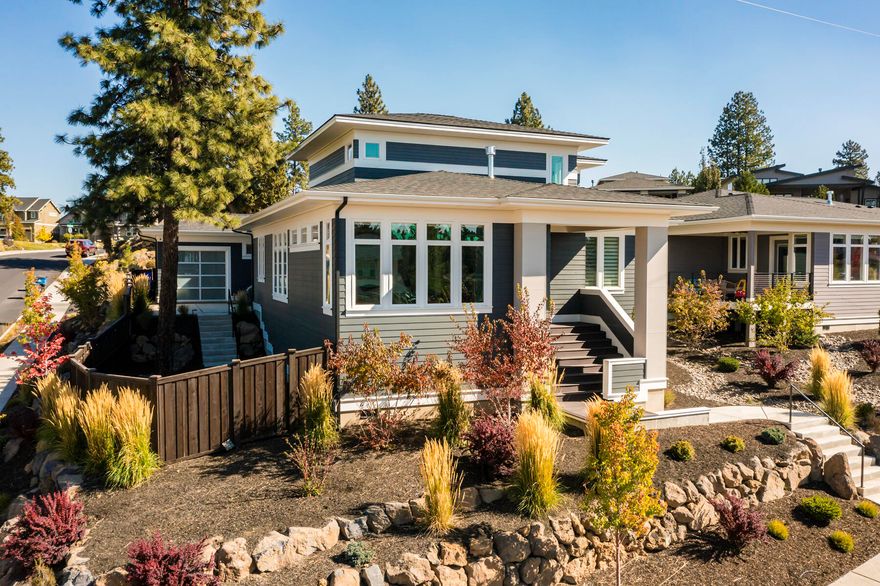 Take a look at this stunning home in Shelvin Bluffs with breathtaking mountain views. Located near Shevlin Park's walking and biking paths, this home features an open kitchen, dining, and living room area with floor-to-ceiling concrete tile, stained wood beams, a built-in TV cabinet, and a modern gas fireplace. The kitchen is equipped with a 48'' professional-grade stainless gas range, brown alder cabinets, and quartz counters. The main floor includes an office and a master bedroom with a large en-suite bathroom. The master suite boasts its own private patio that is wired and ready for a Hot Tub. Upstairs, features a bonus room and two additional bedrooms, each with their own full private bathrooms and walk-in closets. Custom Epoxy garage floors, EV circuit, and third garage door opens to the main entertaining area of the backyard with established landscaping for pets and guests to feel right at home.  This lightly lived-in home is move-in ready and won't last long!