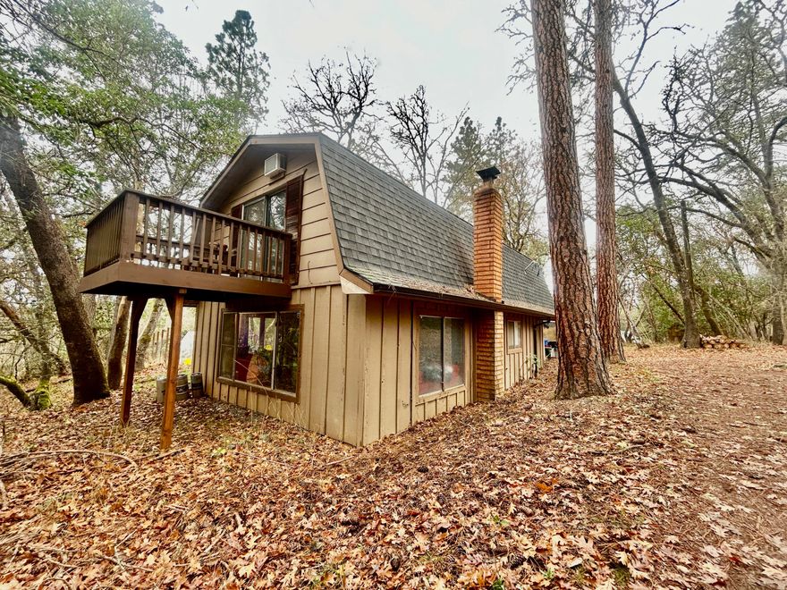 Here it is! your home in the trees! just under 1.5 acres - Home features 2 bedrooms 2 bathrooms -downstairs is kitchen/living room/laundry/bathroom. Upstairs are both bedrooms, second bathroom, a middle room used as an office with a deck/balcony. Recently re-roofed, fenced garden, 8GPM recent well flow test on hand! Showings start 12-7