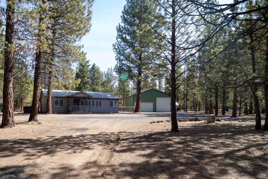 This is one you won't want to miss!!  Remodeled 3 bed home has many upgrades and new items including, fixtures, vanities in both bathrooms, sinks, LED & Edison lights, refinished cabinets with new hardware, pellet stove, water heater, all new service lines under the sink, new shower doors, new Hunter fans and new thermostat.  Water filter system with heated tape.  Shop has metal roof, new lighting and doors with both 50 & 30 amp service, loft storage area, and plumbing with new water heater.  Landscaped front yard with concrete walkways in both the front and back yards. Covered back deck has been extended it is complete with LED outside lighting and is the perfect place to be on warm summer nights!  Back yard is fenced and gated.  Room for your RV with full hookups.  You will definitely be surprised at how big this little home lives!