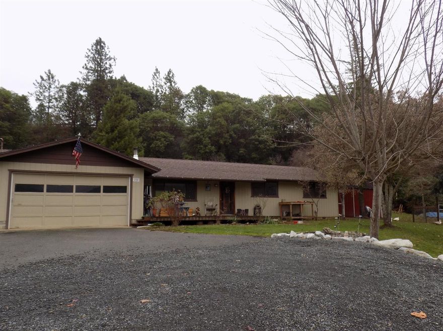 Just right for the gardener & animal lover! Seller's had planned on this being their forever home but plans have changed. Sitting back from the road on 1.33 acres, this 1456 sq. ft. 3 bdrm, 2ba ranch offers an open concept living room, dining area & kitchen. There are views of the mountains from the large front deck or out the front window. There are two seating areas so visiting friends and family will have plenty of room to congregate and visit. It has new tile flooring throughout the public spaces & bathrooms plus new carpet in the bedrooms. Just a few of the recent upgrades include a new heat pump & ductwork, new range/oven, custom wood blinds, wood stove & hearth, chicken coop, 10 X 20 shed, animal pen plus a fenced garden with grape vines. The driveway has been expanded for additional parking with a rock retaining wall. The options are great for this special property just waiting for your special touches. Come preview today.