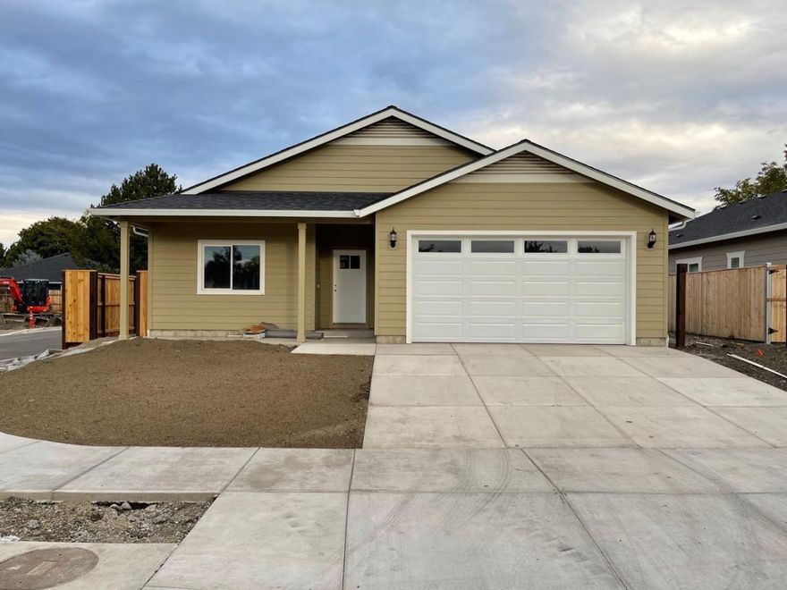 Estimated completion end of November 2021!  4-bedroom, 2-bathroom, NEW CONSTRUCTION a huge corner lot home built by Harmony Modern Homes in Central Point. Step inside this 1766 sq ft home to find an open floor plan with vaulted ceilings in the main living areas and beautiful kitchen with quartz countertops, and stainless-steel appliances. The sizable master bedroom has a walk-in closet with a dual sink vanity in the master bath. This home feels complete with a finished 2 car garage, and landscaped yards for outdoor entertainment.