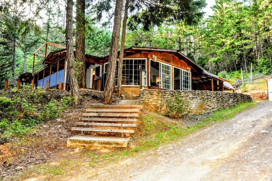 Peaceful and quiet home in Wolf Creek, Oregon. 26+/- acres of diverse land. Plenty of room to garden or raise livestock on the lower portion of the property and the back portion offers a treed hillside. The home is located back from the road for maximum privacy. This well maintained triple wide home features 3 beds and 2 full baths and boasts 2060 square feet of living space with a nice layout. The oversized, detached garage is over 1000 square feet has its own deck and could easily fit four cars. A portion of the property has recently been logged and there is a supply of harvested trees on site that could be used for firewood. Per the owner the well is a very high producer. No drive-by viewings, please contact your Realtor today for a showing.