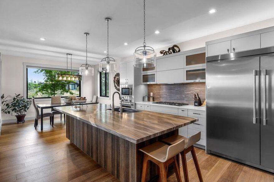 This exceptional 2022 custom home resides within Broken Top's prestigious, guard-gated community.  The orientation of the lot takes advantage of cascade views from the kitchen, living room and primary suite.  The stunning kitchen features a grand granite island, Thermador appliances, and a stylish dry bar with a beverage fridge.  The main-level primary suite is a luxurious retreat with a steam shower, freestanding tub, and walk-in closet. A striking steel staircase with white oak accents leads to two upstairs bedrooms, a bath, and a bonus room.  The deck off the upstairs bonus room offers jaw dropping mountain views and has radiant heating for year round enjoyment. Exterior highlights include natural stonework, snow melt walkway, and stamped, stained concrete in the courtyard and spacious patio.  An EV charger adds convenience and sustainability. This home epitomizes modern luxury.  Embrace the CO lifestyle, close proximity to Mt. Bachelor, forest trails, schools, & downtown Bend.