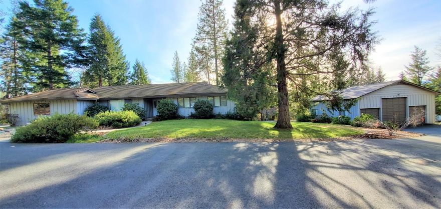 Wow, this is the first sale of this property since built and Dennis Schmitke was the builder who builds fine custom homes. Private gated entry and fenced is this one story home with storage underneath with it's own standard door entry. Large open living room and family room. Great deck off the kitchen with everything already landscaped. All paved to the property and on the property with many areas for RV parking, boats, cars etc. One huge bonus to this home is the 3 car detached garage/shop with tall doors for RV parking inside. Total of 5 garages! New carpet in the living room and well maintained. This is not a drive by. Want your piece of paradise? This is it! All info deemed accurate but not guaranteed and subject to change at any time.