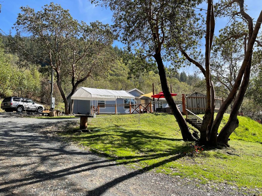This 4.57 acre property sits just 6 minutes out of town. Privately situated with views of the mountains you'll find yourself enjoying the relaxing front yard seating area. The home was built in 2011 and has a very nice open floor plan with great lighting throughout. The master suite has a large bathtub and shower while on the opposite side of the home are the other two bedrooms and bathroom. This home is move in ready for a family or anyone that would like a home on acreage that backs up to BLM. The house has electric heating and air conditioning along with the wood burning fireplace. **Please no drive bys.**