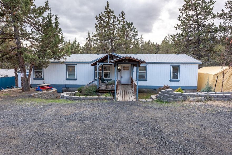 Motivated Sellers!! Home on .63 acres in the lovely Ochoco West Community. Home features extra large rooms and has new cabinets in kitchen and laundry room. There is a storage shed for your gardening supplies and a 1,000+ sqft shop with electricity and a woodstove. The triple lot next door is also available for $99,000 for those who may want an extra large parcel, or to build next to family. Nicely treed lot w/ room to roam & parking for all of your toys. Come enjoy all the amenities Ochoco West has to offer! Swimming pool, club house, shooting range, miles of trails for your horses or ATVs, horse boarding, private fishing lake, etc. This home is on community water.