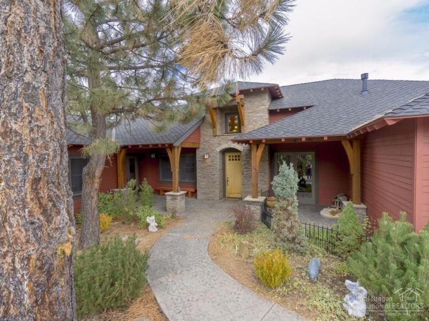 This beautiful home overlooks the Deschutes River & River Trail. Secluded by mature pine trees w/privacy. Features: huge master suite with elegant bath; large gourmet kitchen with slab granite, hardwoods, custom tile & stainless appliances! Separate living room, formal dining, great separation. Large deck for entertaining, Anderson iron clad windows & doors, 2 car garage & single car garage w/picture window. Could easily be an office/gym/studio! Community offers: private pools, clubhouse, common areas.