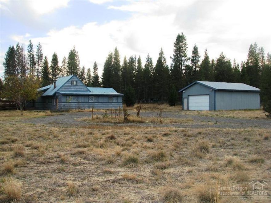 Country lifestyle close to hunting, fishing, skiing. Situated on fairly level corner lot in private pine-treed area. Picturesque home surrounded by meadow, circular drive. Large newer shop, plus other outbuildings on the property, suitable for animals & other hobbies. Home boasts large welcoming front porch. Living area is spacious with windows around. Convenient kitchen w/adjoining walk-in pantry, plus cozy dining area. 2 bedrooms + loft, walk-in closet, 2 baths, utility, enclosed porch. Call now!