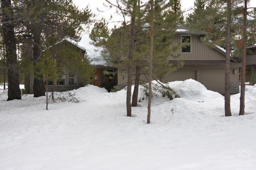 Beautiful lodge style home with open living area, vaulted ceilings, floor to ceiling stacked rock accented fireplace, wood floors and lots of windows to make this home light and bright. Extensive wood floors, solid core doors, 3 car garage and large Mahogany wood deck with private hot tub for extended living. Close to Fort Rock Park. Room enough to bring the whole family on vacation!