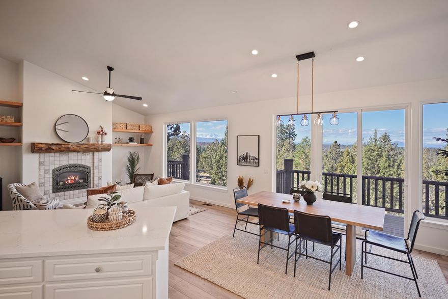 Prepare to be wowed by the panoramic mountain views from this beautiful home on Bends Westside, privately situated on nearly an acre. This home has been newly
renovated and features an open floor plan, vaulted ceilings, and tons of windows allowing for an abundance of natural light. The spacious primary suite is located on the
main level along with a guest bath and laundry room. Downstairs you will find the secondary bedrooms, a full bath, an office, and a flex space. Experience the evening
sunsets from the expansive decking on both levels, overlooking the peaceful water feature and the forest valley beyond. The river trail is at the base of the property in the backyard- hop on and go for a stroll or bike to downtown Bend in no time! The large heated 3-car garage features 10' doors, a workbench, and sink. Don't miss the large
storage area! The entrance is located on the north side of the downstairs deck.