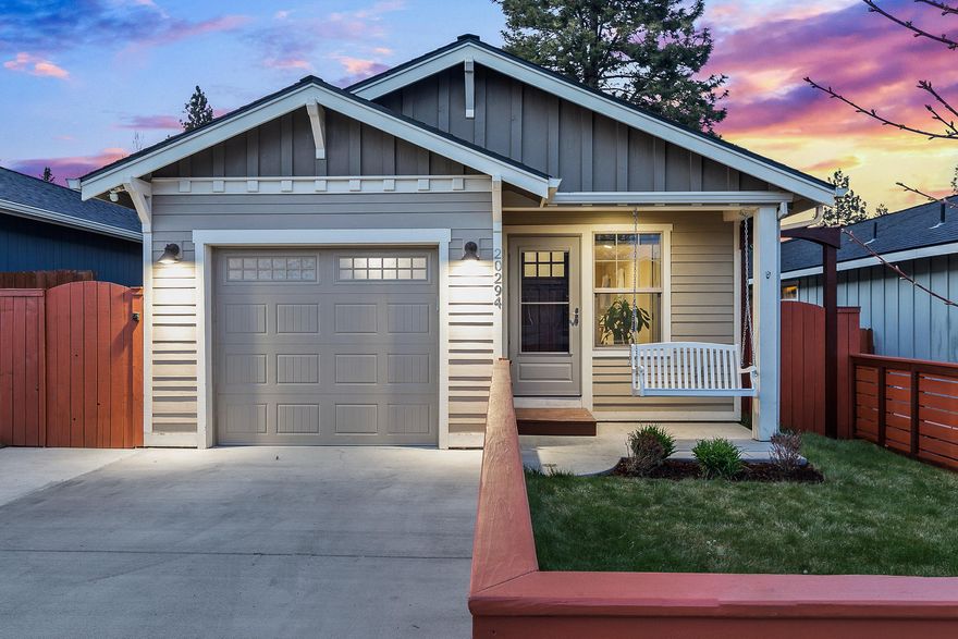 This craftsman style home features a very versatile floor plan with the master bedroom on the main level and two guest bedrooms and bonus space downstairs. Perfect for a small family and would also make a great vacation home or investment property. Finishes include granite counters, low maintenance laminate flooring, and stainless steel appliances. A great back deck for soaking up the sun and a hot tub for relaxing after a long day compliment this home very well. Fully fenced with an easy-to-maintain front lawn, this eye-catching home has great curb appeal. The single car garage has a built in storage closet that makes a great pantry. Downstairs also features a very useful storage space off of the family/bonus room. The safe and friendly west side neighborhood is conveniently located near Bend's newest elementary school North Star, Harvest Park, Sawyer Park, and Riley Ranch Reserve. Just two minutes to Target and Trader Joe's, this hidden gem neighborhood and home is not one to miss.