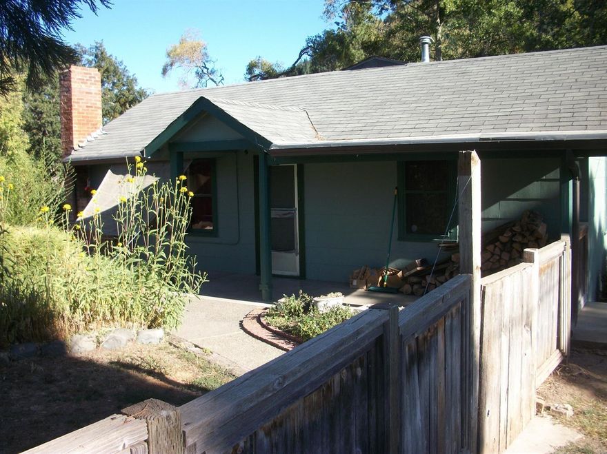 Cute, older home on the Rogue River.Lots of room for a garden and fishing right out back! Small shop or art studio area in garage area.