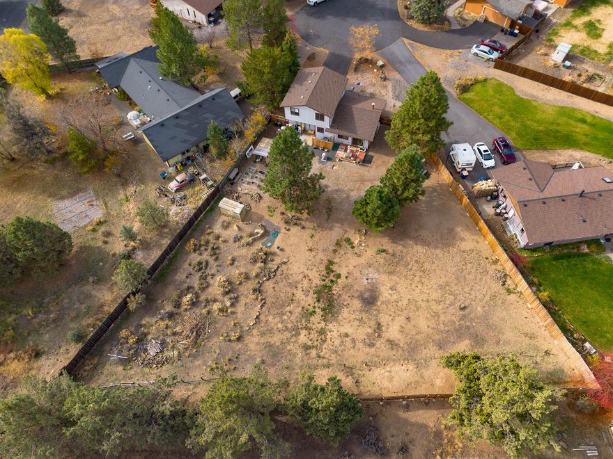 WOW! A rare find on a 0.52 acre lot in SE bend, on a quiet cul de sac, with a cute clean, updated home, with room for a shop, greenhouse, and so much more, that has been totally fenced.  Don't miss this opportunity, will go quick! Home has a newer High efficiency furnace and heat pump, plus a newer hot water heater, with back up newer super efficient mini split.  This properly has its own access to a super cool underground cave for the adventurist. Mountain views from the upstairs main bedroom. Open great room downstairs