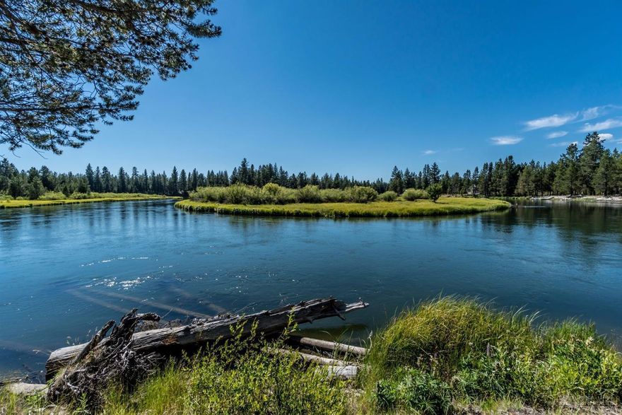 Riverfront stunner! Views with floor to ceiling windows with private view of the Deschutes River. Home is situated on a private dead end on 5.82 acres with immediate access to the river, forest and all the outdoor recreation Central Oregon is known for. Downstairs you've got an open living, dining and kitchen area with vaulted beamed ceilings and two good sized guest bedrooms and full bath. Upstairs is the private and generous primary suite with full bath and extra loft space for an office, library, or just a spot to look out at the stunning scenery. Wrap around composite decks offer great outdoor dining and entertaining space, additional RV garage/ hookups, workshop and storage provide extra room for toys and there's a private dock leading right to the river. This home is near US Forest lands, La Pine State Park, Bachelor and Sunriver. Hike, kayak, ski, fish and float all from this oasis. Radiant heat through-out & garage. Sold Furnished. Established rental history.
