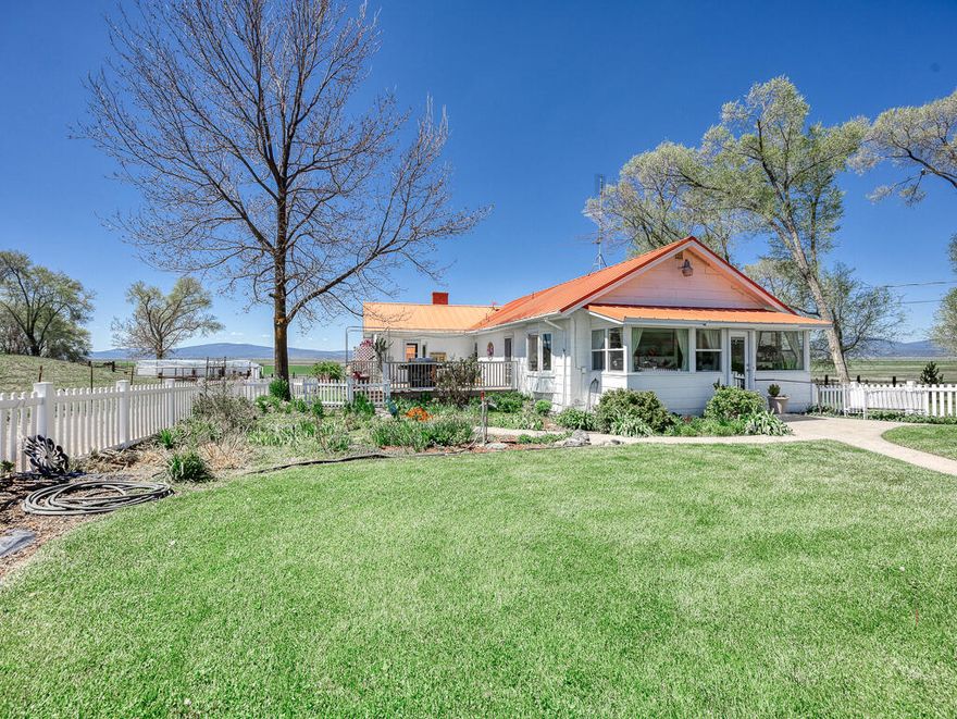 Irrigated 40+ acre farmstead w/beautifully updated 2,040 SF main home set up for country living w/comfort & style. The 2-bed/2-bath home features leather granite counters, engineered hardwood floors, utility room w/built-ins, abundant storage & finished basement w/fireplace & large flex-space with its own entrance. Separate yards offer areas for beauty and functionality. Relax on the Trex deck under the custom removable shade cloth & take in the panoramic view of your new property with Mt. Shasta in the background. The property also offers ample parking, 2 detached garages, a greenhouse & garden area plus an extra storage unit. Additionally, the property has a large mobile w/updated finishes for extra income or extended family. The 40+ irrigated acres are fenced & cross-fenced, flood-irrigatable & livestock-ready w/a barn, corral system & field feeders. A rare, clean & functional acreage package w/comfort & infrastructure already in place. Ready to run animals on day one.