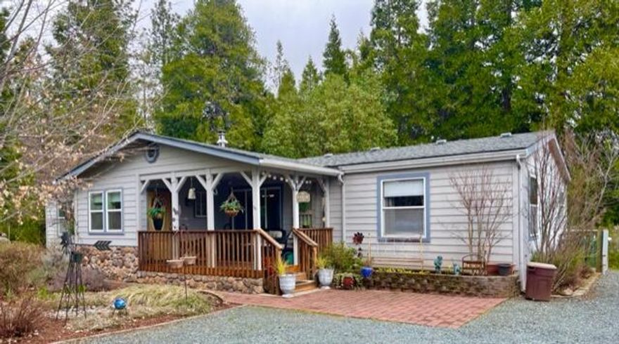 Immaculate park-like 4.6 manicured acres. Stunning remodeled Fleetwood manufactured home (you'd never know it!) 4 bedroom, 2 bath, split floor plan, single level, beautiful primary en-suite with walk-in shower and soaking tub with great view. Kitchen upgrades include new cupboards, quartz counters, custom pull outs, convenient island prep area and large adjacent dining room. New roof 2008, previous well test showed10 gpm. Detached 3 car garage/shop 1000', taped, textured and painted with permits in 2008. Large barn (will hold at least 2 cars, maybe 3) with electricity. Plus an additional newer shed with electricity.  Covered cedar deck and mud room added at front entrance and large trex deck in back to enjoy outdoor living and BBQs.  A truly special property with great view, amazing grounds and special spot to enjoy life.