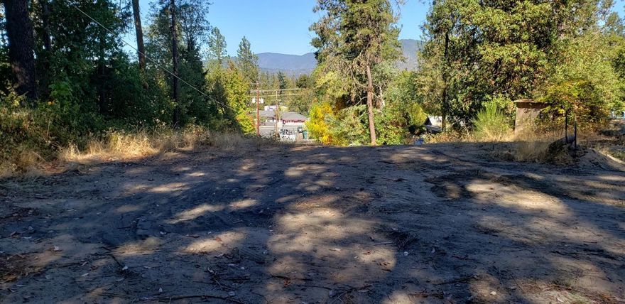All utilities at the property with existing well or check into hooking up to city water. A former home was at this land site but now cleared and ready for your new home on this private dead end street off of Fruitdale Drive in Grants Pass. This should be a slam dunk easy way to build your home on and its located close to all things in the city but with a treed backdrop nestled in the woods. Cozy feeling in this neighborhood with a spot for you ready to go. Check with planning for permits etc.All information deemed accurate but not guaranteed and subject to change at any time.