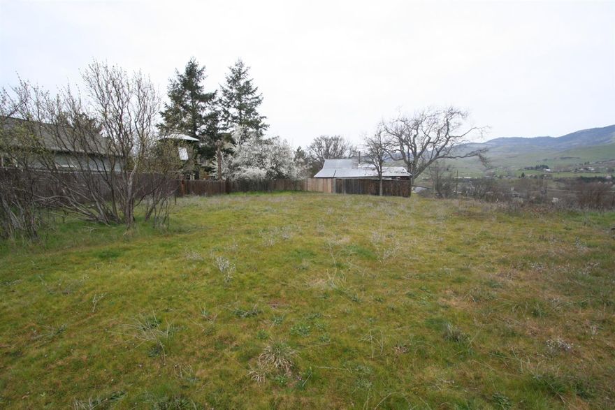 This is a unique opportunity in a great, close-in Ashland location. There are two tax lots for sale for a total of .86 acres. Situated off the road this property has some mature trees, quite a bit of level usable space, and is ready for development. There are gorgeous views of Grizzly Peak and there is nice privacy. There is sewer, power and water to a previously home site (that home burned down) plus the Seller believes there are several other utility connections at the street (buyer to confirm). This property appears to be a good candidate for a cottage housing development, a home with a legal detached ARU or potentially to subdivide into more lots. There are a couple of structures on the property of little to no value. Buyer to do their own due diligence.
