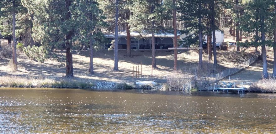 RIVERFRONT With Mature Pines!! 1 acre parcel with over 140' of Williamson River frontage! This beautiful home features an open concept design, three spacious bedrooms with walk-in closets and recently installed laminate flooring. Enjoy the peace and serenity of the Williamson River from the comfort of your living room or step outside and enjoy from within the enclosed patio!