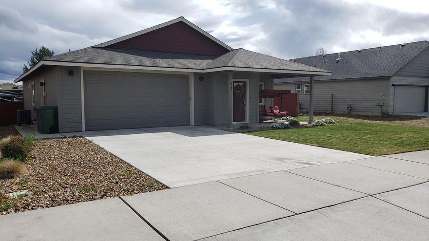 PRICE REDUCTION!!!  This home with 1, 578 sq. ft. built in 2018 on a larger lot of over 8,700 sq. ft. with Cascade Mountain Views is waiting for you.   Fully landscaped front yard and newly installed back yard, plenty of grass and room for the dog / family to enjoy.  There are 3 bedrooms, 2 full bathrooms, one level home with laminate floors in the great room, kitchen and hallways with carpet in the bedrooms to keep your feet warm.  Large island in the kitchen with a sink.  The great room is very open to the kitchen and dining area.  Two car garage and a long enough driveway your suburban or F-350 does not stick out across the sidewalk.  The home is built on a cul-de-sac, very little traffic with sidewalks and planter strips for great curb appeal.
