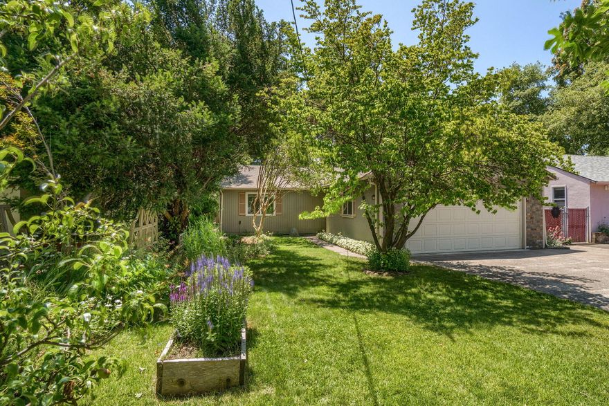 Welcome to this charming 3-bedroom, 3-bath home, in desired Old East Medford. This 1,710 sq ft residence offers a thoughtfully designed layout, featuring two master bedrooms and laminate floors. The living room is flooded with natural light from large windows and tube lighting. The open-concept kitchen, with its new skylight, flows seamlessly into a beautiful fully screened porch - perfect for entertaining. Step outside to a private, fully fenced backyard with lush landscaping, a paved patio, and storage shed. The spacious two-car garage provides extra storage with easy attic access and shelving. Washer, dryer, and all appliances are included for a truly move-in ready experience.