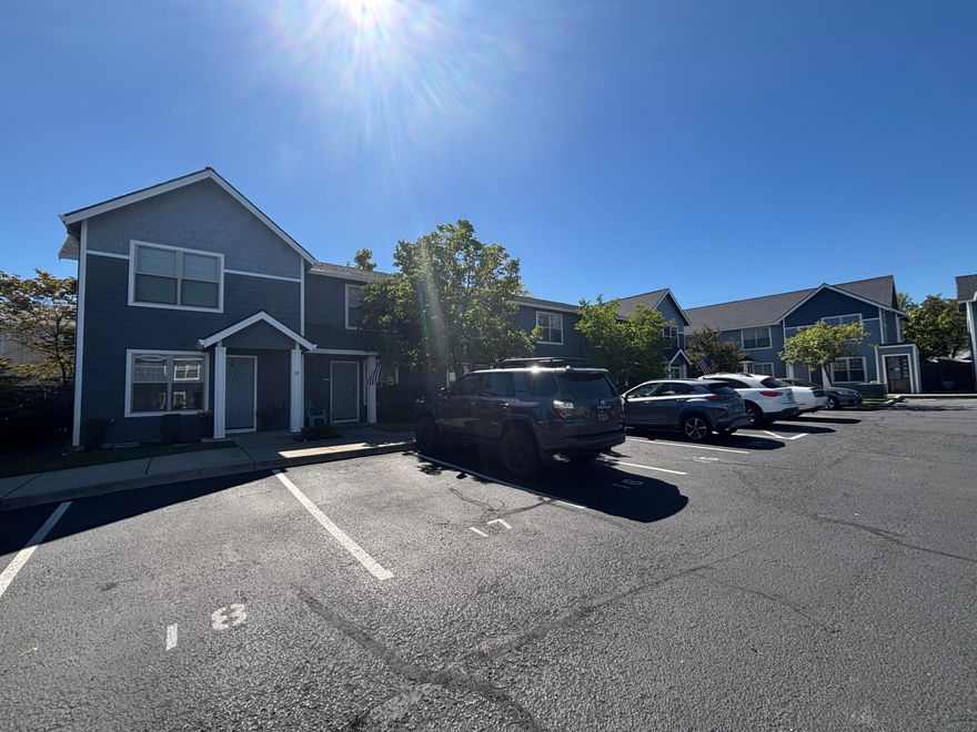 Welcome to this well-kept home in the desirable Midway Townhome community, offering easy access to shopping, dining, and local amenities. Enjoy a quiet location away from the main street with a dedicated parking space included. The spacious main-level living and dining area flows seamlessly into a bright, functional kitchen with convenient laundry and a guest half-bath. Upstairs, two comfortable bedrooms are separated by a full bath, providing privacy and pleasant views. HOA dues cover water, sewer, trash, landscaping, and all exterior maintenance—making for truly low-maintenance living.