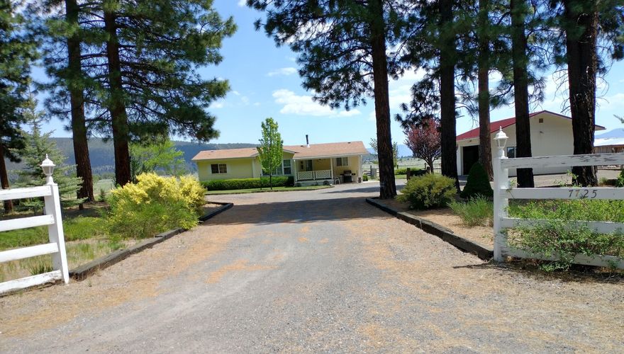 Must Love Country!  3 Bedroom, 2 Bath MH & detached oversized garage on 40 acres near OR/CA border.   This well maintained 1994 Skyline MH has some nice updates and a few custom features with scenic mountain & valley views.    The home features; new roof in April 2023, appx 1248 sf, split floor plan, Corian counter tops, walk-in shower, vaulted ceilings, skylights, vinyl windows with lots of natural light, F/A electric heat plus a cozy woodstove and covered front & back porches.  Outside you'll find a large 2 car detached garage with extra room for storage or workshop. Other great notables; large corral, shed, covered tack/hay area & woodshed.  Manicured front & back lawns, huge gravel driveway with extra parking for vehicles and trailers, fenced garden area and more.  Make your appointment today! AS-IS WHERE-IS. 
15 miles to Dorris or Macdoel,  36 miles to K Falls city center.