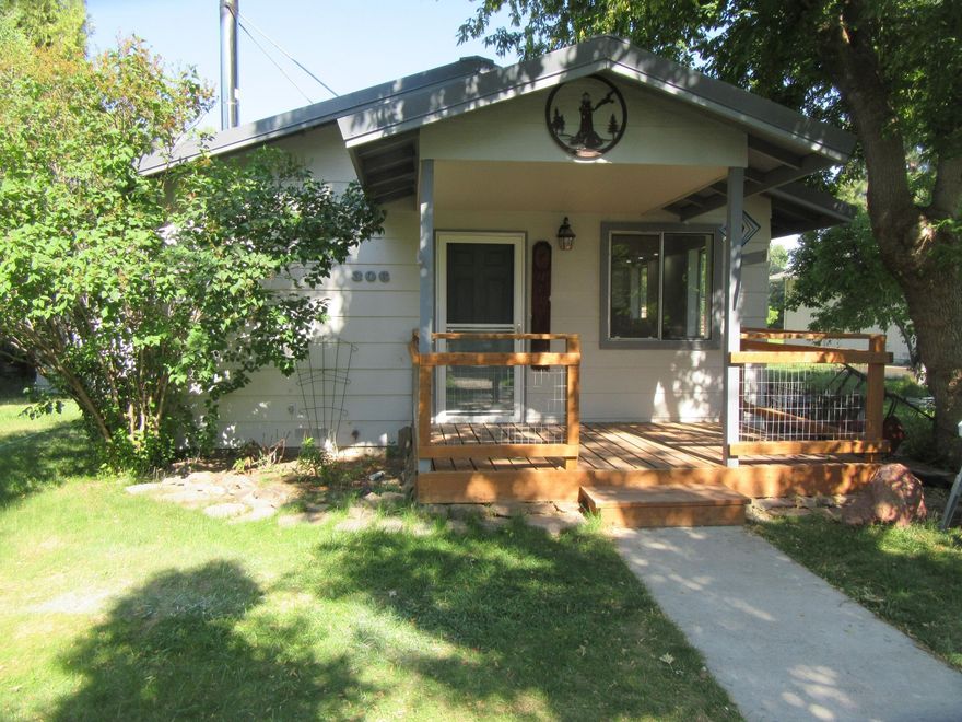 Cute Home w/ Covered Front porch& Fenced front & backyards. Recently update Kitchen & Bathroom. New Interior paint & flooring. Super nice. Attached Room out back currently used  for ''She Shed'', could be used for a lot of things. Detached metal shed in Backyard. Call for appt to see this sweet home.