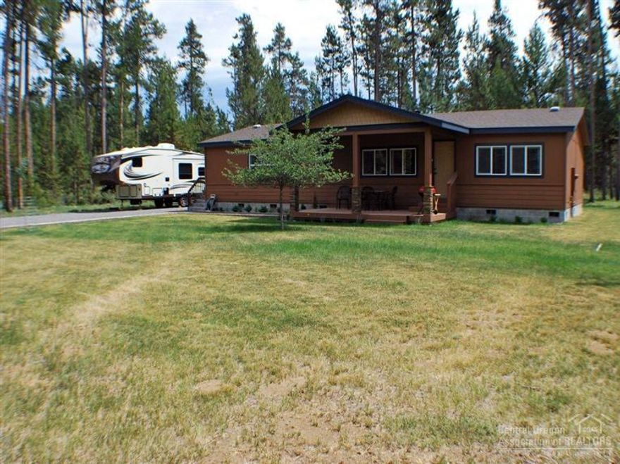 This home shows like new, single level home with all new custom knotty cherrywood cabinets throughout, 2 year old appliances, kitchen island, built in wine rack, kitchen is a custom design, newer carpet, vaulted ceilings, master with large custom bathroom, garden tub with tile surround, tile back splash in all bathrooms & kitchen, covered custom front porch with rock accents. Landscaped yard, RV parking & hook ups, detached garage and 10 x 12 storage building, pride of ownership shows throughout this home.