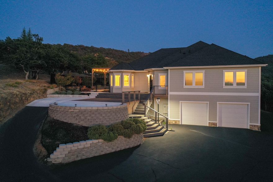 HUGE PRICE DROP! NOW JUST $1,150,000! This stunning 4,098SF custom, modern home is a show-stopper! Sweeping, breathtaking views from nearly every window. Private setting on the outskirts of Medford, yet only minutes to town. Extensively remodeled in 2019-2021 w/many thoughtful built-in amenities & custom features. Primary suite w/French doors to large deck, open beam ceilings, sitting area, walk-in closet, separate vanities, beautiful soaking tub, walk-in shower, marble tile floors, quartz counters & chandeliers. Massive great room w/fireplace, soaring vaulted ceilings to upper level w/office, loft & family room. Open gourmet kitchen w/huge island, custom cabinets, granite counters, Wolf appliances, dining area, walk-in pantry & breakfast nook. Lower level has bonus/workout room & utility room. Helping you save $100s per month, brand new, solar system installed $85,000 - completely paid for. New hot tub, fully fenced/gated, 4-car garage, separate 1-car garage, & RV parking.