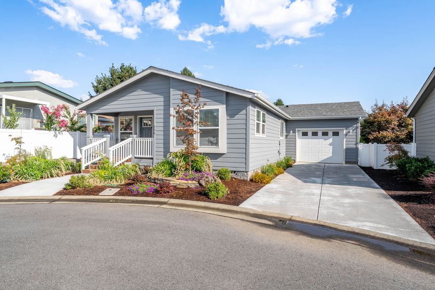 Brand new Energy Star home in Westlake Village, the premier 55+ community with competitive space rent of $850 per mo. Pet friendly w/restrictions & approval. Home offers an office, vaulted ceilings, & an open layout filled with natural light. The kitchen is well appointed with gas range, microwave, refrigerator, dishwasher, farm sink. Outdoors you will find low-maintenance landscaping, a charming covered front porch, & a fenced backyard with covered deck, perfect for enjoying peaceful evenings or entertaining friends. The oversized single-car garage features an automatic opener for convenience. Gated entry, management staff, a scenic lake, walking paths, gazebo, a clubhouse with event space, library, and fitness center—all complimentary to residents & guests. Ideally located close to downtown, & the Rogue River. One-year factory warranty included. Priced below cost! Buyer to perform their own due diligence into all aspects of the home & park. Buyer to obtain Tenancy Park Approval.