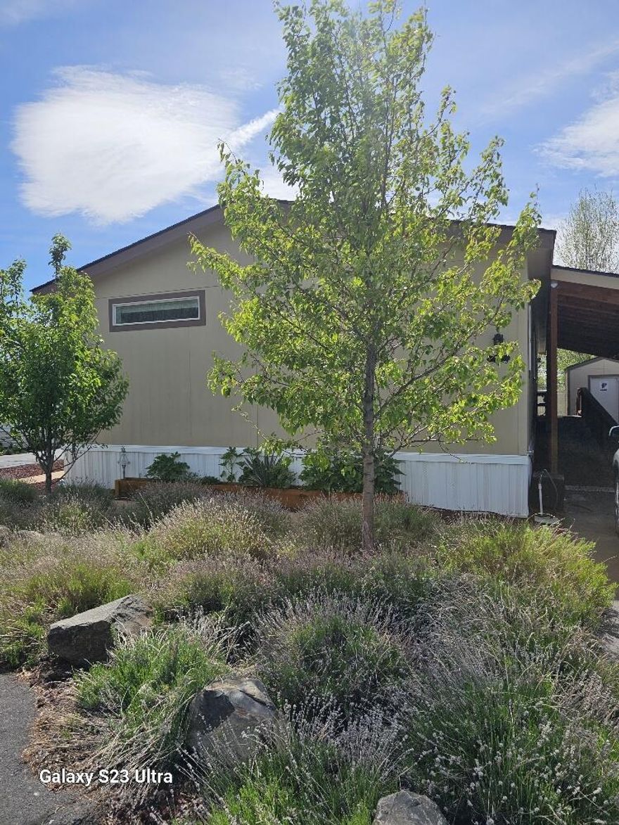 This is a beautiful, feels like brand new, 3 bedroom 2 bath home! There is plenty of elbow room with a family and a living room area, all open to the kitchen for a nice big great room feel. Nice sized bedrooms and closets. All appliances stay! Notice the high end blinds that open from the bottom or the top and window coverings. This is one of the nicest MH's I have ever seen. It has been very well maintained and shows pride of ownership. There is also a small shed for extra storage and a cute little back patio. Note that the wheelchair ramp in carport can be removed and stairs are still intact for more room for your vehicle. Must get park approval prior to accepted offer.