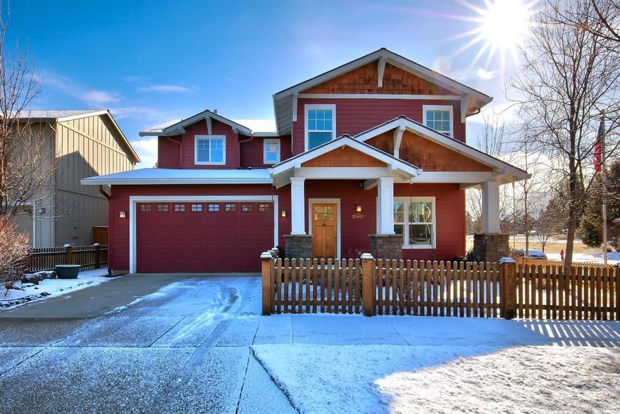 One look at this idyllic 4 bed, 2 1/2 bath Bend farmhouse & you'll fall in love w/its sweet picket fence, charming red exterior & terrific yard. Breathtaking from top to bottom, features high ceilings, exposed grid beams, large stone fireplace w/flanking built-ins, hardwood floors, enormous light-filled windows, shaker-style wainscoting & recessed lighting. In the kitchen, ceramic tile floors & granite countertops. The bedrooms are large & comfortable, but the Master takes the cake w/a corner set fireplace.