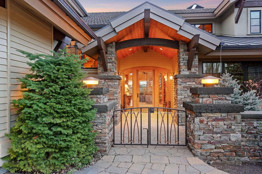 Enjoy the stunning Cascade Mountain views from this timeless, exquisite, and superbly built Pacific Northwest home in the esteemed golf community of Tetherow. Located on an elevated and coveted location within Tetherow, this 5200 sq. ft. home offers a serene setting and unencumbered mountain views from the enormous Great Room with soaring ceilings, thanks to its strategic location on the golf course. This home features a chef's kitchen with exquisite solid slab granite countertops, an enormous kitchen island, and top-of-the-line appliances. If desired, take the ELEVATOR upstairs and indulge in the luxurious master suite with a fireplace, separate water closets for him and her, a steam shower, a spacious walk-in closet, dressing area, laundry amenities, and potential fitness room/flex space (currently used as a safari trophy room). Additionally, there are two guest en-suites, a wine storage area capable of accommodating 100 bottles, a media/theater room, and a stunning office.