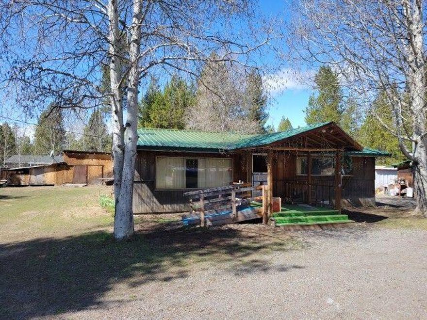 Looking for a single level home on a large lot at a great price? Look no further!  This charming vintage home features 2 beds, 1 bath, open floor plan, and multiple outbuildings.  So many possibilites at a great price!