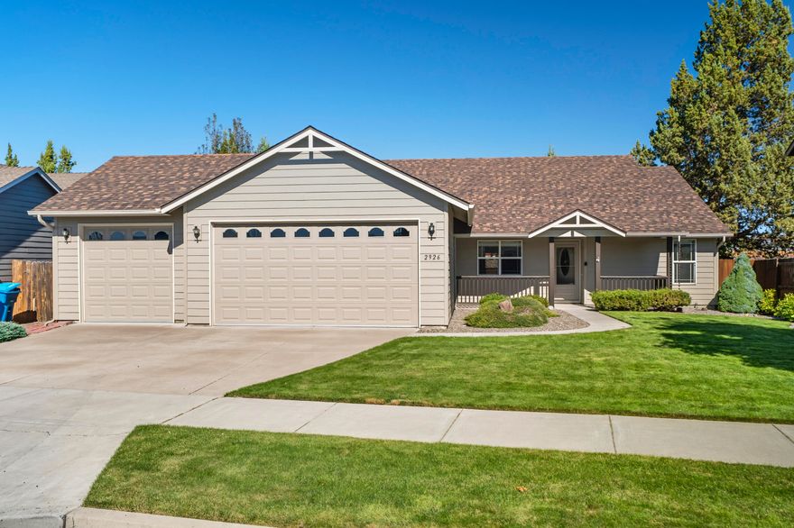 Perched in Redmond's sought-after NW side, this elegant home captures views of the Dry Canyon. A spacious 3-car garage and professionally landscaped grounds set the stage, while a generous covered patio offers the perfect backdrop for entertaining or quiet relaxation. Inside, rich hardwood floors and a warm gas fireplace create timeless comfort. The thoughtful floor plan places the primary suite on one side of the home, with guest rooms on the other for added privacy. A new roof in 2024 ensures peace of mind. Just beyond your doorstep, miles of walking, hiking, and biking trails wind through the canyon, blending refined living with the beauty of Central Oregon's outdoors.