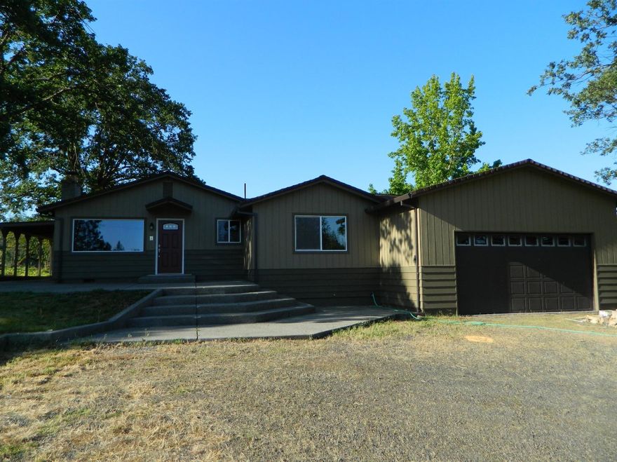 Excellent opportunity. 3 Bedroom 3 Bathroom remodeled home that sits on 1.27 acres. Master Bedroom is large with walk in closet ( a bunch of room) and a master bath which has double sinks and good size shower. Interior has new paint, laminate flooring, and new carpet. Kitchen has been remodeled with new cabinets, solid surface counters, and stainless appliance package. Move in ready. Vinyl windows. Outside is nice and level. Property is cross fenced in back and Great for horses or to put all of your toys. Flood irrigation. Garage is oversized and has high ceilings. Multiple covered patios. This is a very nice rural pocket of rural Eagle Point.