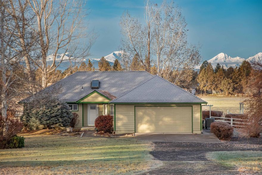 Better than new, close-in home on a park-like setting. The home is situated on 18.60 acres with 12 acres of irrigation and a large pond. It has it all...lush, beautiful gardens, green pastures & big Cascade Mountain views!. It is a little slice of heaven. Recent updates include: a complete refresh of the bathrooms and kitchen, new fireplace, new heat pump, water heater, appliances and much much more. The home has a wonderful, open floor plan with lots of natural light. This mini-farm also has a garden shed and a 1440 sq ft out building with heated, insulated shop including a bathroom. Farm deferral keeps taxes low. Could be great horse property. Come see this well maintained, spectacular property!