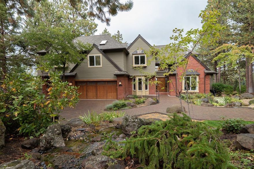 Stunning & updated Awbrey Butte home checks all the boxes. Sweeping & unrestricted views North & to Smith Rock. Sophisticated & private outdoor living suite with covered kitchen, fire pit, hot tub, & park like grounds. Meticulously manicured lot with Koi pond, cascading water feature & plantings for year round beauty & splashes of color. Open & inviting-the perfect flow/convenience of master suite, office, formal dining, kitchen, living room, & patio on main level. Enjoy patio access from the large master that boasts built in cabinets, walk through closet, & completely remodeled bath. Attached one bedroom apartment has full bath, kitchenette & bonus space-could be the perfect spot for extended family, home theater, or bonus game room. Truly room for all of the toys- easy slope paver driveway & three car garage with ample parking. Large finished space under the back deck complete with an additional 1/2 bath and roll-up door for the perfect man-cave, artist studio, workshop, or storage.