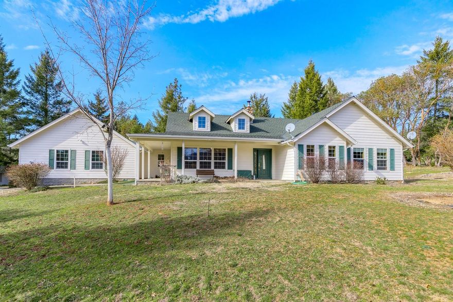 This is a WOW! Lovely home on 5 park-like acres in the desirable Springbrook Subdivision.  As you enter the property, the paved drive meanders by the beautiful pond & seasonal creek.  The home, built in 2002, features an open floor plan, grand rock fireplace adorns the living room, vaulted ceilings, 2054 sq ft, 3 bedrooms plus an office & 2 1/2 baths.  Entertain in the large kitchen with breakfast bar & oak cabinets.  The dining area looks out to the patio & back yard. Relax in the master suite, complete with vaulted ceilings, jetted tub, dual sinks, huge cultured marble shower & walk in closet.  Exterior features include attached over-sized 2-car garage, detached 15 x 25 garage, 26 x 18 metal shop, sprinkler system & beautiful mountain views! Is this YOUR new HOME?
