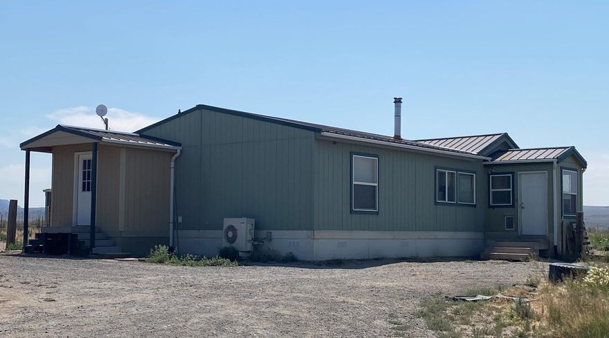 Nice private home on 20 acres set up and ready for all your animals.  This property has several stalls and a heated shop! There are close to two acres of irrigated fields. The house has three enclosed porches, one with a ductless system installed.  Get a close up view of Table Rock right from the front window! Please do not drive onto property without appointment.  Dogs on Property