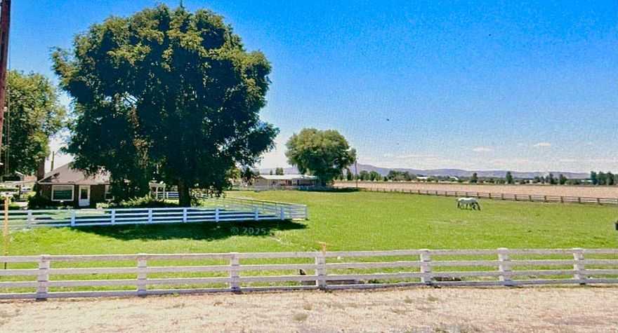 Bring your hobbies and dreams to this rare 24.79-acre property. Space for your horses, livestock, equipment, and so much more! Established rental income included. This hobby ranch has 23.7 acres of Class A irrigation rights via KID. Zoned FR and conveniently located just 5 mi from Merrill. The original ranch-style brick 2,850 SF 4BD/2BA home includes an expansive master suite, wood fireplace, natural oak and marble features. The detached one-car garage offers ample storage space and bonus room. The 1,680 SF ADU manufactured home offers 3BD/2BA with an oversized two-car detached workshop garage and many custom updates. Custom hay barn, with 500-ton capacity with finished railing for options of equestrian use. Large hand-hewn timber barn, corrals, and many other outbuildings. Fully fenced and cross-fenced with a new domestic well, agricultural well, mainline, and wheel lines. Outstanding opportunity with reliable water and fertile soil that once was a lakebed, offering excellent yields.